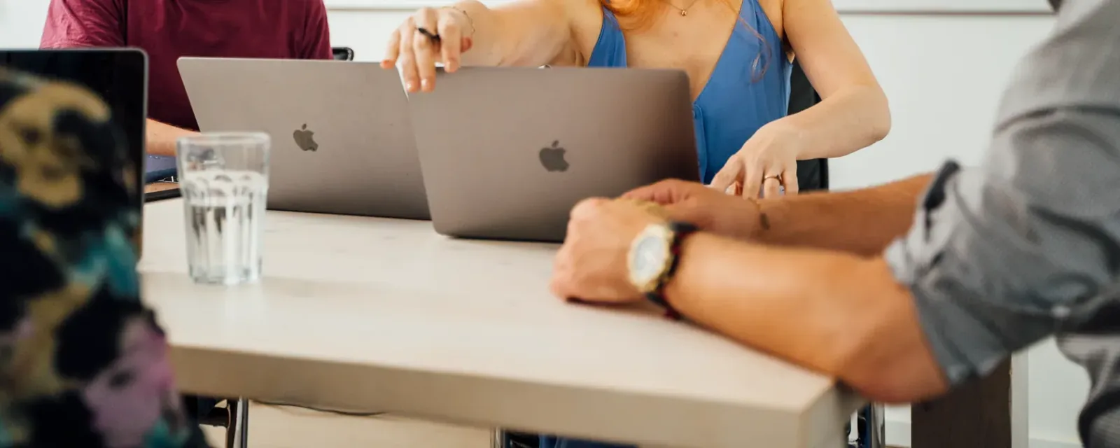 Team working out governance structures on a laptop